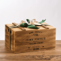 A wooden gift box containing 1 pack of Riso Melotti rice, sweet and savoury rice snacks, rice chocolates and rice beer.