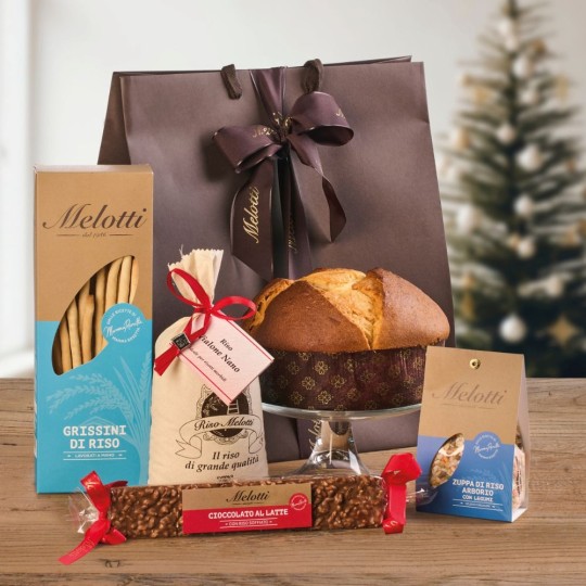 Melotti gift bag containing Vialone Nano Rice, rice snacks, and Riso Melotti Offella, a true Christmas classic.