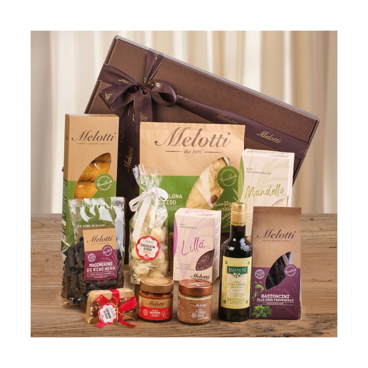 Gift box containing a selection of Melotti products, rice varieties, sweet and savoury snacks, chocolate and olive oil.