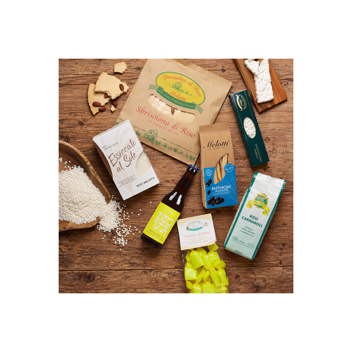 Scatola Melotti contenente riso Vialone Nano essiccato al sole, riso Carnaroli e snack dolci e salati di riso, birra al riso