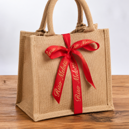 Borsina juta regalo con i prodotti della linea benessere all'amido di Riso- crema mani e candela alla cannella e rosmarino